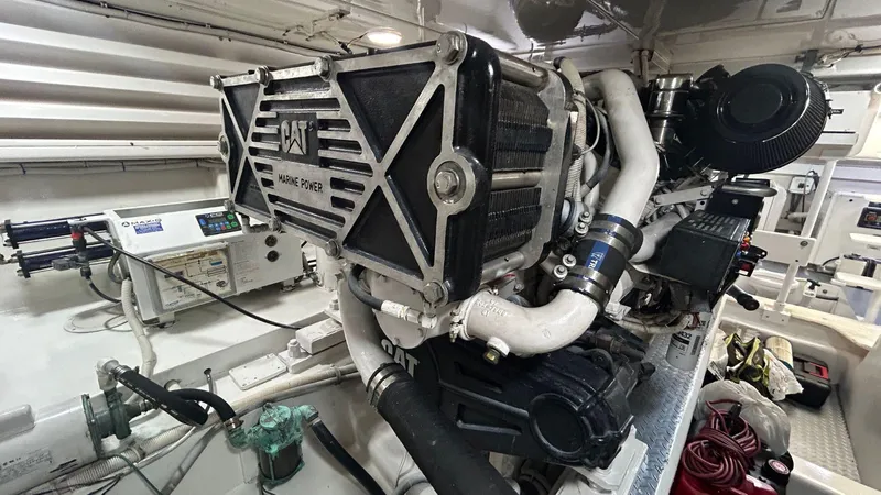 Sin Plan Yacht Photos Pics Engine room of a 2005 Bertram 630E yacht with CAT marine power.