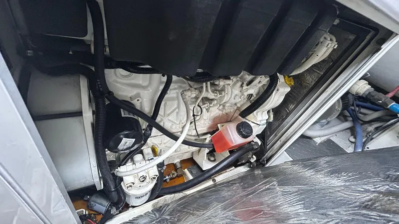 Sin Plan Yacht Photos Pics Engine compartment of a 2005 Bertram 630E yacht.