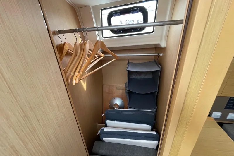Moonshadow Yacht Photos Pics Closet interior of 2016 Beneteau Oceanis 38 yacht with hangers and storage.