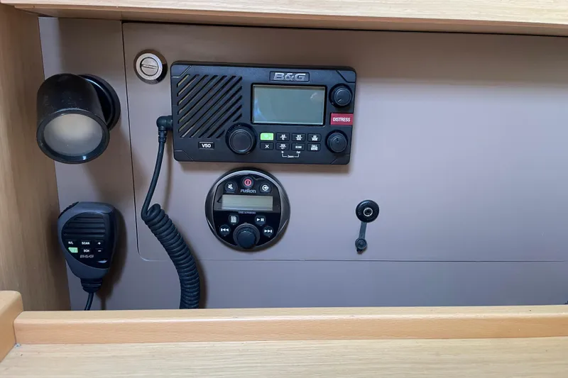 Moonshadow Yacht Photos Pics Control panel of a 2016 Beneteau Oceanis 38 sailboat with communication equipment.