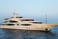 Luxurious 2001 Oceanco Custom yacht sailing on calm blue waters.