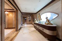 Luxurious yacht interior with elegant sculptures, marble flooring, and modern design elements, Oceanco Custom 2001.