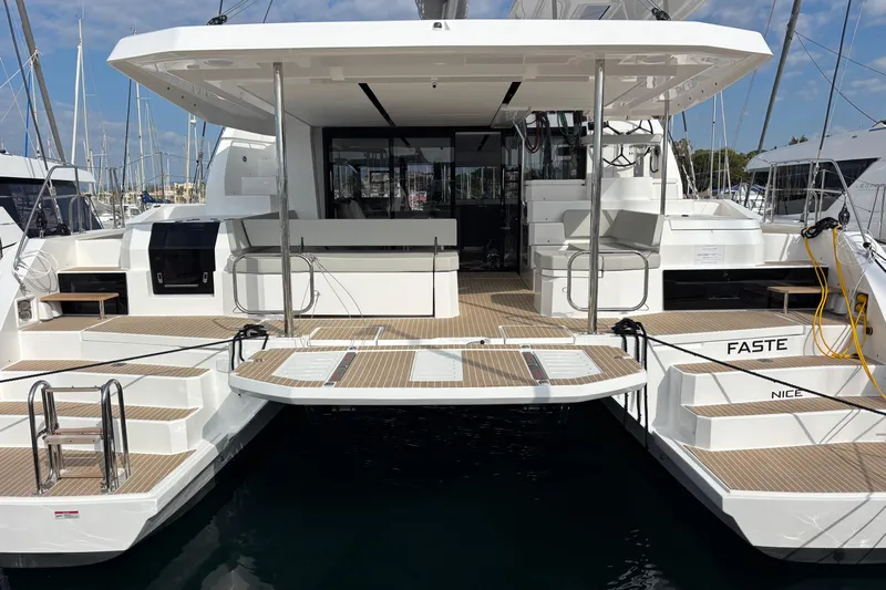 Faste Yacht Photos Pics Sleek 2025 Leopard 52 yacht with spacious deck and modern design in marina.