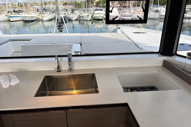 Faste Yacht Photos Pics Modern kitchen on 2025 Leopard 52 yacht with marina view.
