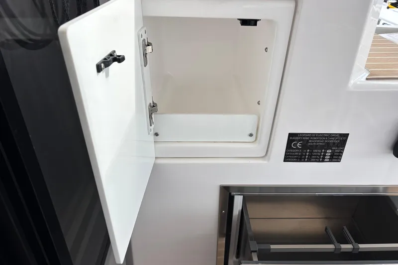 Faste Yacht Photos Pics Open storage compartment on 2025 Leopard 52 yacht, showcasing sleek design and functionality.