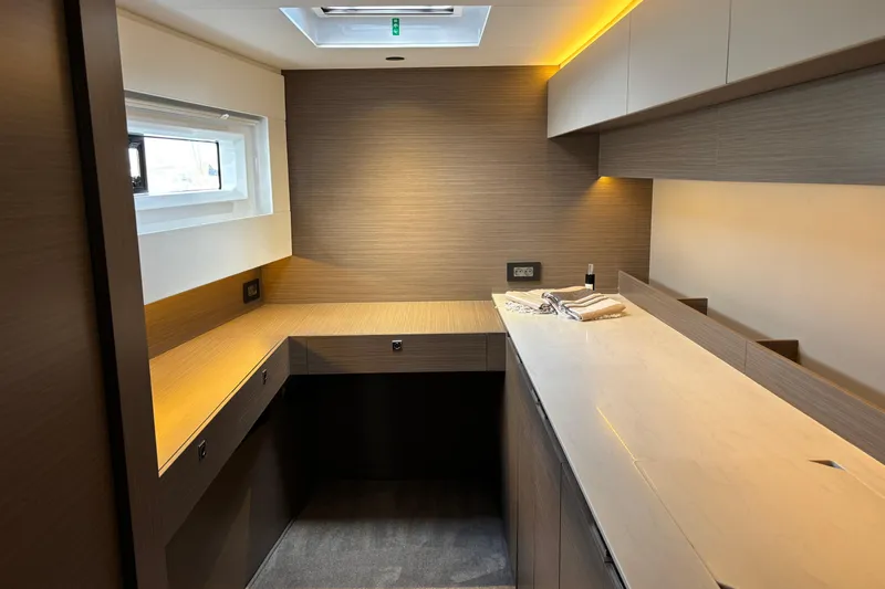 Faste Yacht Photos Pics Modern interior of 2025 Leopard 52 yacht with sleek cabinetry and ambient lighting.