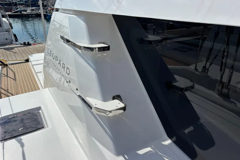 Faste Yacht Photos Pics 2025 Leopard 52 catamaran exterior with sleek design and modern features at a marina.