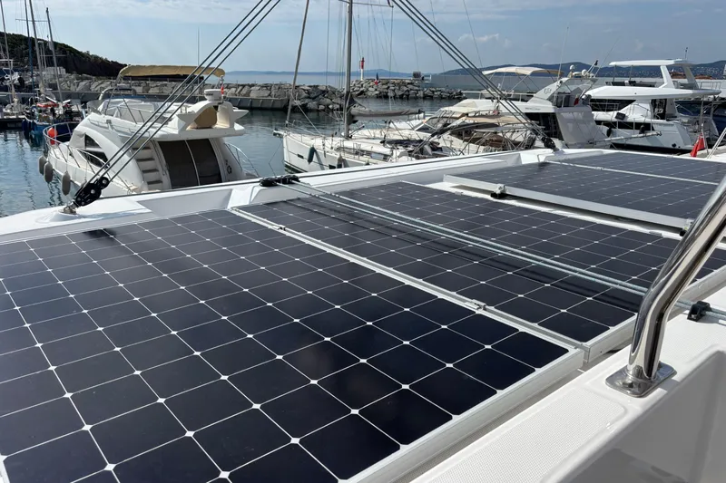 Faste Yacht Photos Pics Solar panels on a 2025 Leopard 52 yacht docked at a marina.