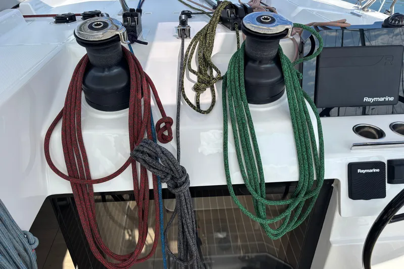 Faste Yacht Photos Pics Winches and ropes on a 2025 Leopard 52 yacht deck, featuring Raymarine equipment.
