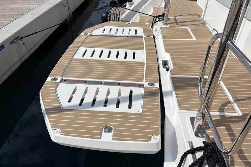Faste Yacht Photos Pics 2025 Leopard 52 yacht deck with sleek wood finish and stainless steel railings.