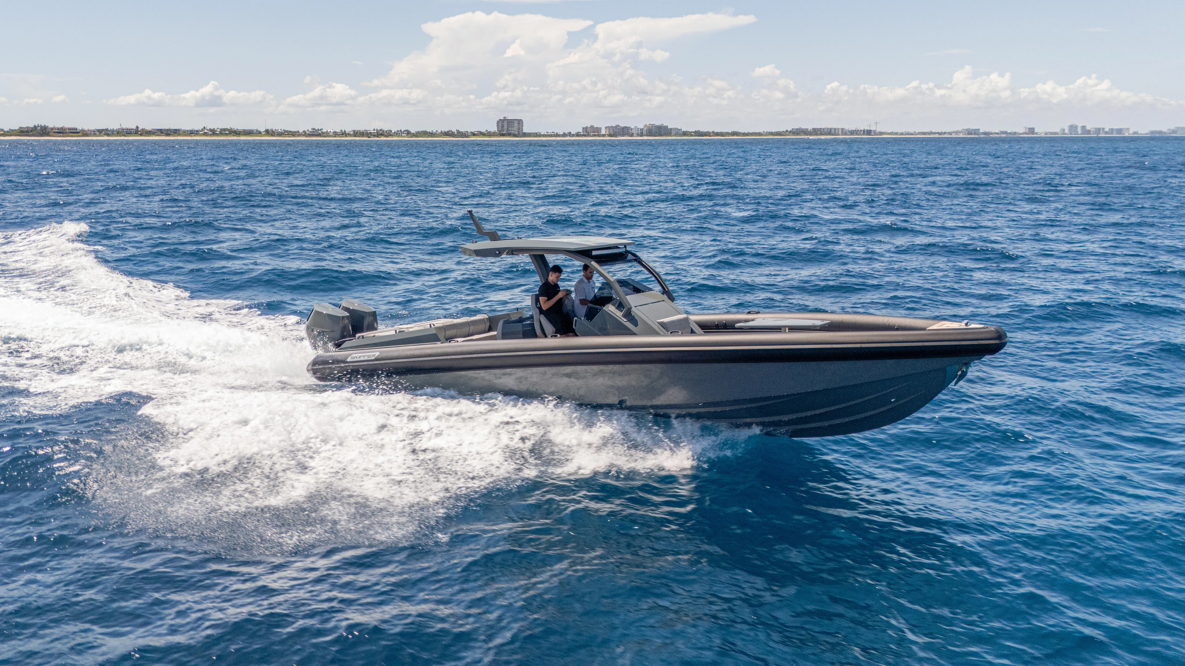 Skipper 38 Twin Mercury 400 Verado - Sunbed Ed. Yacht Photos Pics 2025 Skipper-BSK 38 boat cruising on open blue sea.