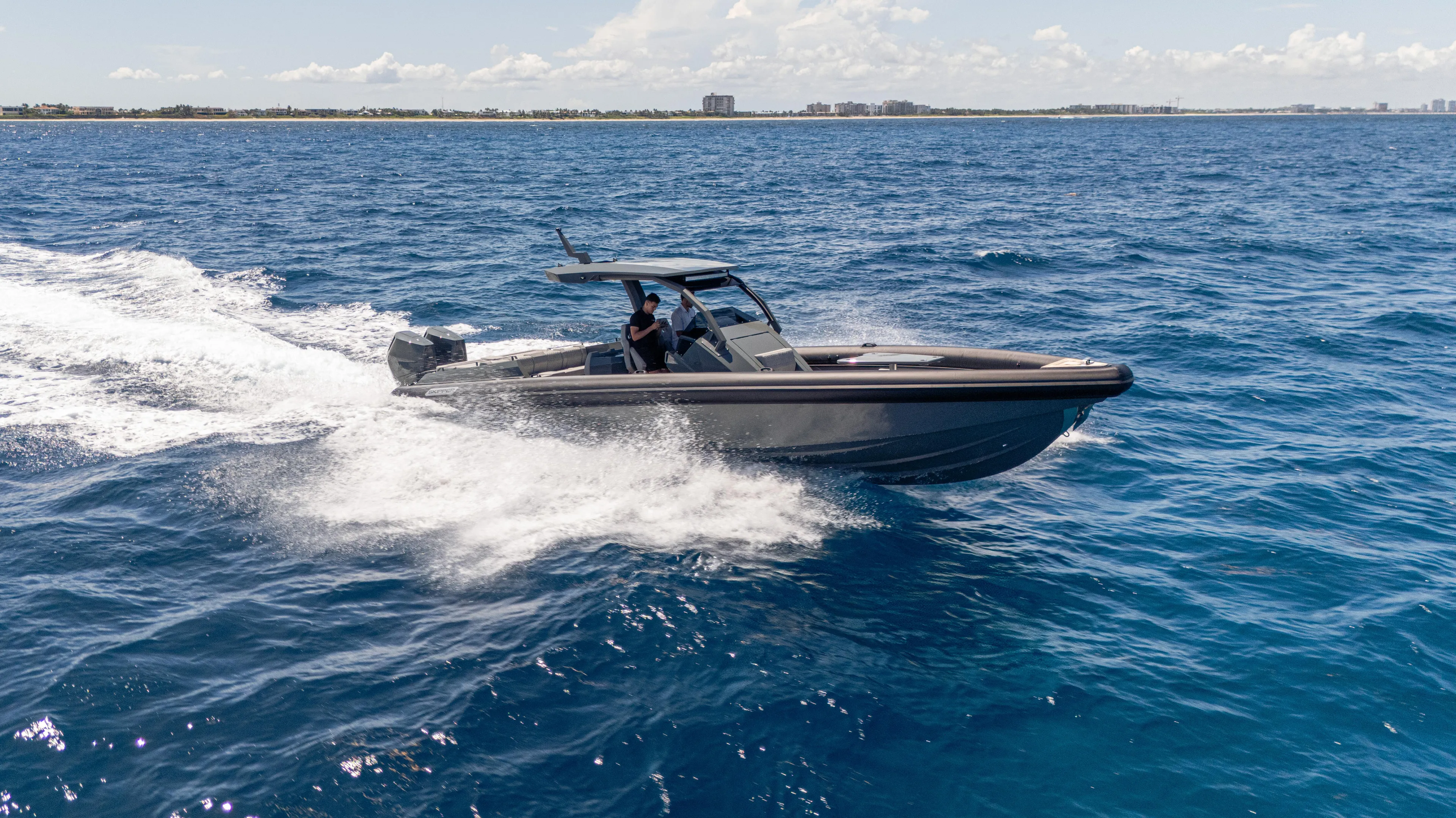 Skipper 38 Twin Mercury 400 Verado - Sunbed Ed. Yacht Photos Pics 2025 Skipper-BSK 38 boat cruising on open blue ocean waters.