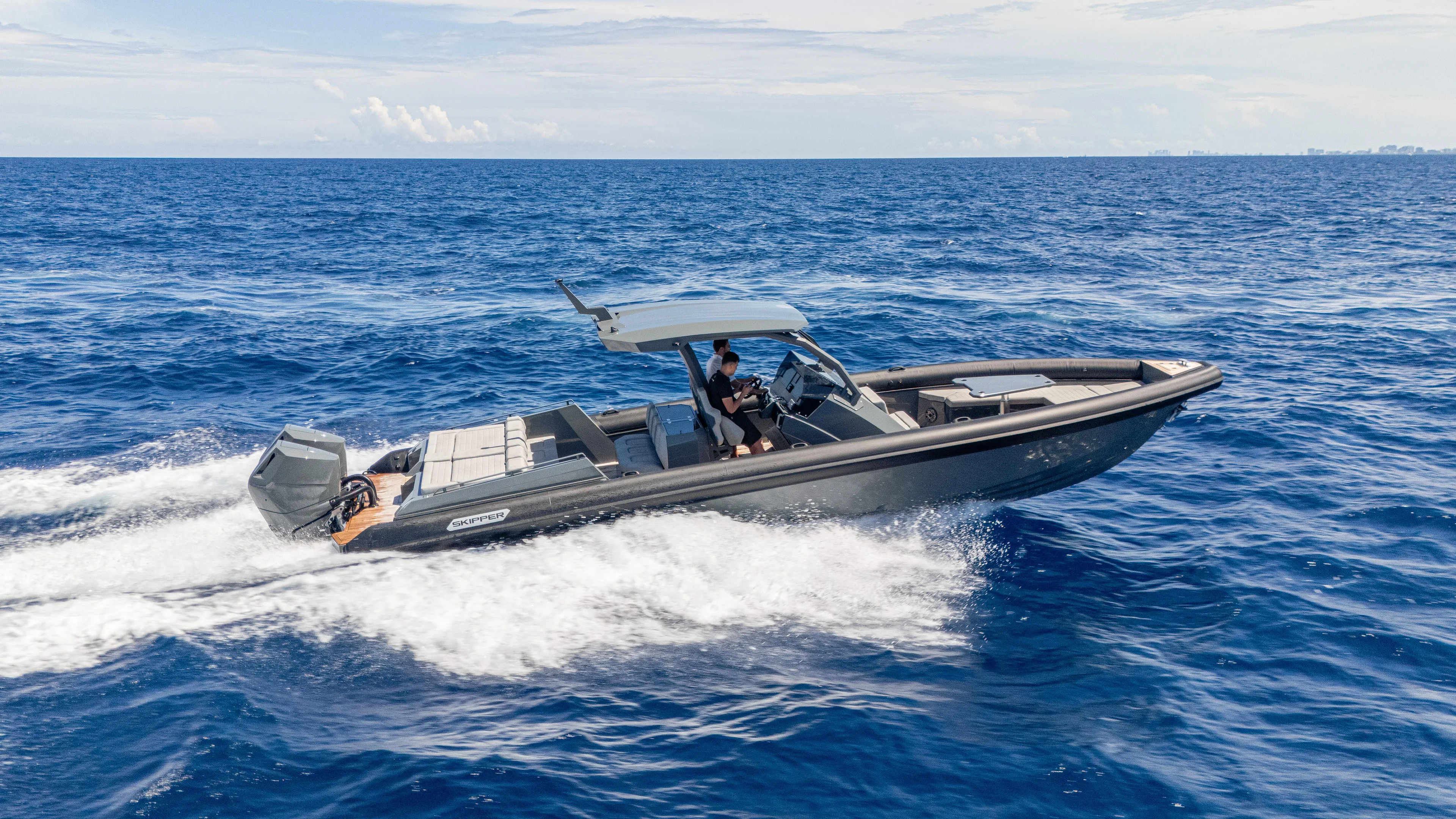 Skipper 38 Twin Mercury 400 Verado - Sunbed Ed. Yacht Photos Pics 2025 Skipper-BSK 38 boat cruising on open ocean waters.