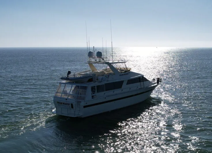  Yacht Photos Pics 1989 Pilothouse West Bay yacht cruising on a sunlit ocean.