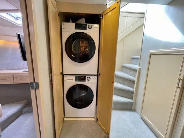  Yacht Photos Pics Stacked washer and dryer in 1989 Pilothouse West Bay yacht interior.
