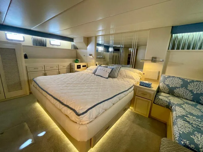  Yacht Photos Pics Luxurious 1989 Pilothouse West Bay yacht bedroom with cozy bed and elegant decor.