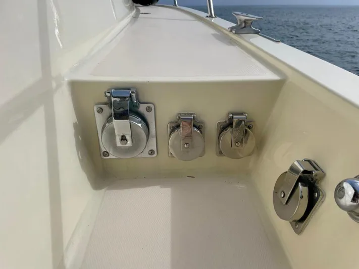  Yacht Photos Pics 1989 Pilothouse West Bay boat deck with chrome fittings, ocean view in background.