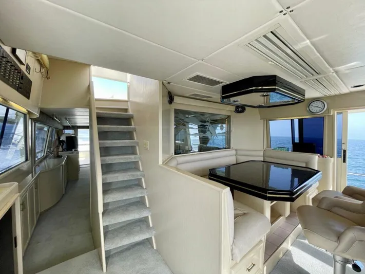  Yacht Photos Pics Interior of 1989 Pilothouse West Bay yacht with modern seating and ocean view.