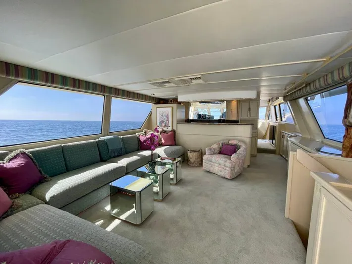 Yacht Photos Pics Luxurious 1989 Pilothouse West Bay yacht interior with ocean view, featuring elegant seating and decor.