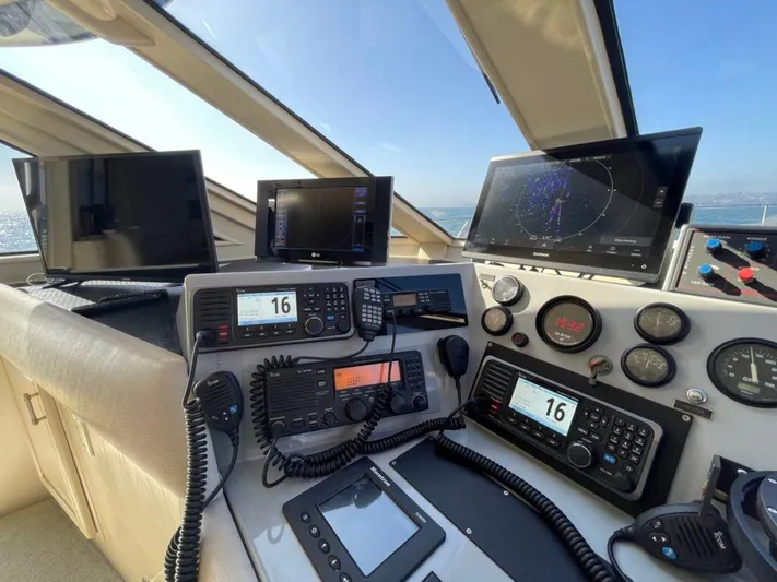  Yacht Photos Pics 1989 Pilothouse West Bay cockpit with navigation equipment and control panels.