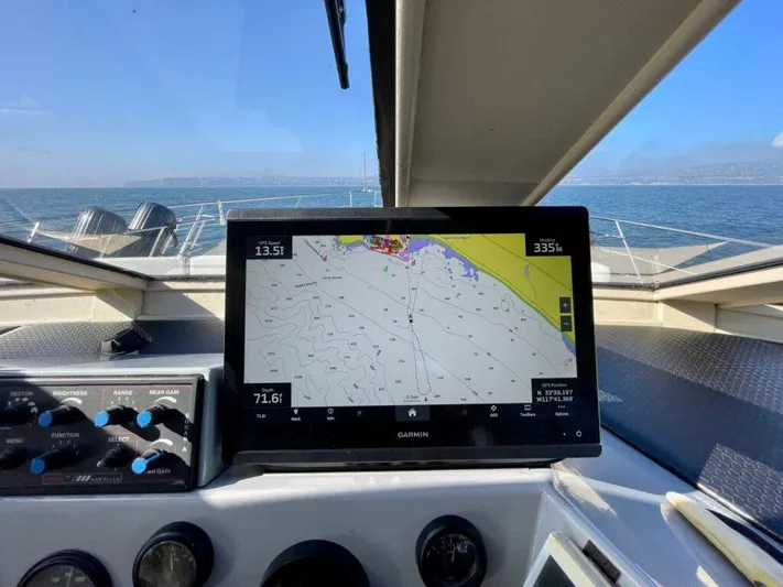  Yacht Photos Pics 1989 Pilothouse West Bay with Garmin navigation system, displaying nautical chart on open water.