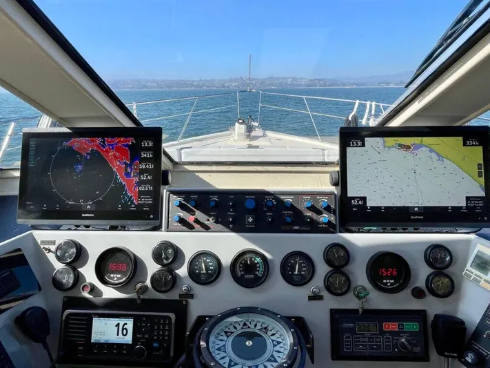  Yacht Photos Pics Pilothouse West Bay 1989 dashboard with navigation screens and controls, overlooking the ocean.