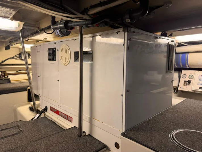 After Midnight Yacht Photos Pics Engine room of 1994 Knight & Carver Lux SF yacht with generator and equipment.