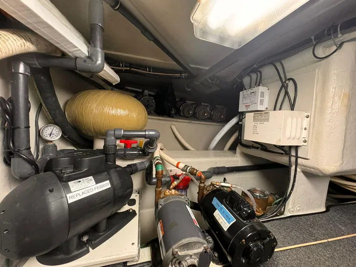 After Midnight Yacht Photos Pics Engine room of 1994 Knight & Carver Lux SF yacht, showcasing mechanical components and wiring.