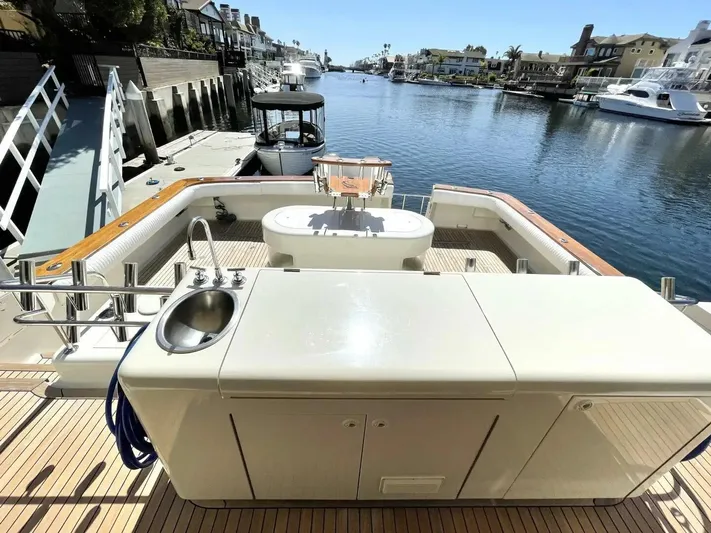 After Midnight Yacht Photos Pics Luxurious 1994 Knight & Carver Lux SF yacht with spacious deck and waterfront view.