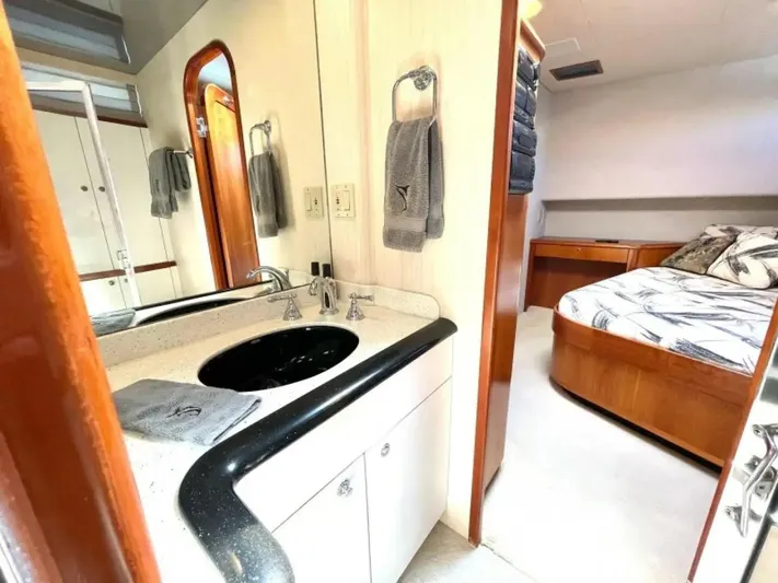 After Midnight Yacht Photos Pics Luxurious yacht interior with bathroom and bedroom, Knight & Carver Lux SF, 1994 model.