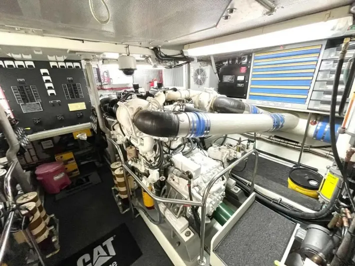 After Midnight Yacht Photos Pics Engine room of 1994 Knight & Carver Lux SF yacht with CAT machinery and organized tools.