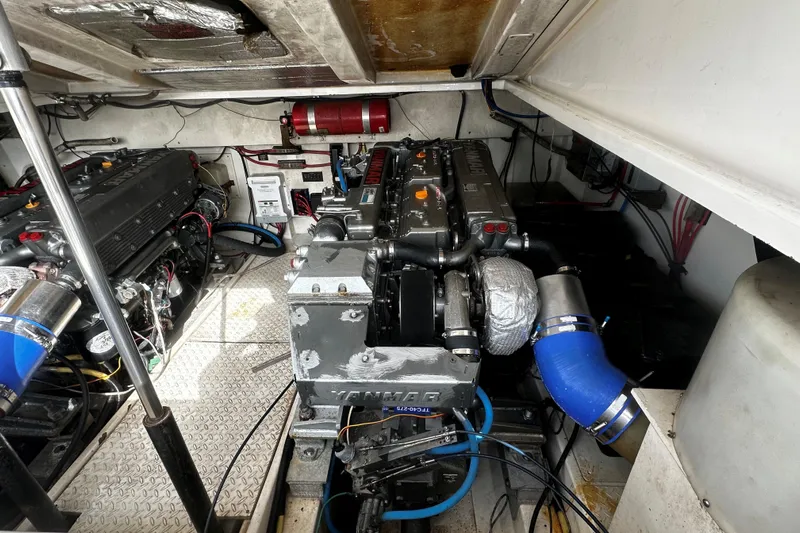Miss Cissa Yacht Photos Pics Engine room of a 2003 Rampage 38 Express boat, featuring dual engines and mechanical components.