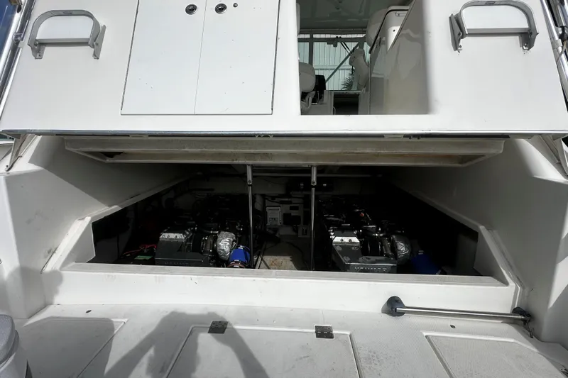 Miss Cissa Yacht Photos Pics Engine compartment of a 2003 Rampage 38 Express boat, showcasing dual engines.