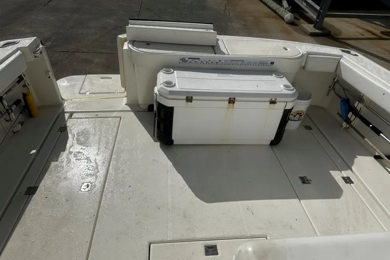 Miss Cissa Yacht Photos Pics 2003 Rampage 38 Express boat deck with cooler and fishing equipment.