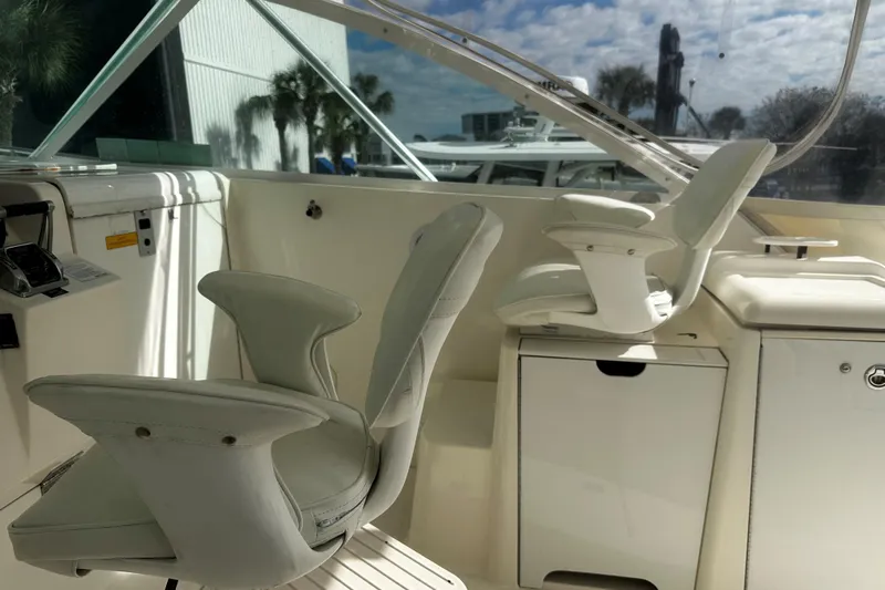 Miss Cissa Yacht Photos Pics 2003 Rampage 38 Express boat interior with white seating and control panel.