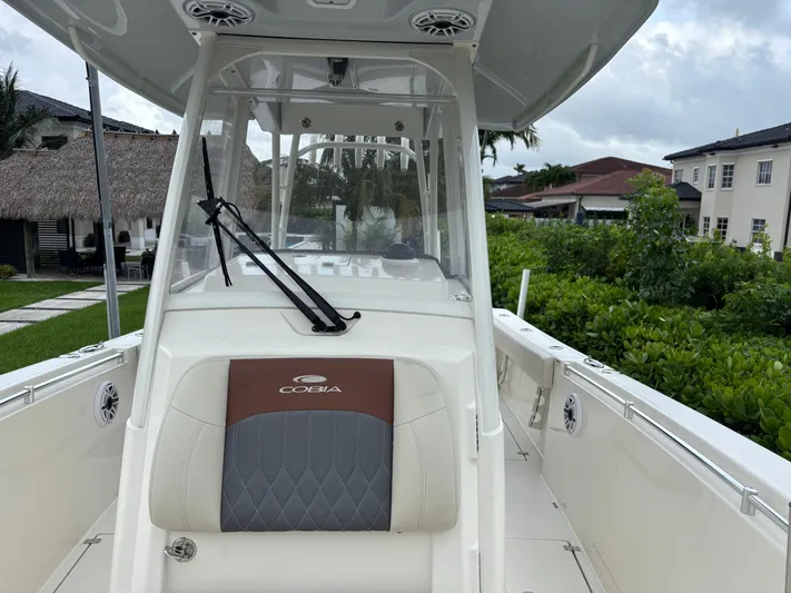  Yacht Photos Pics 2021 Cobia 301 Center Console boat, featuring sleek design and spacious deck.