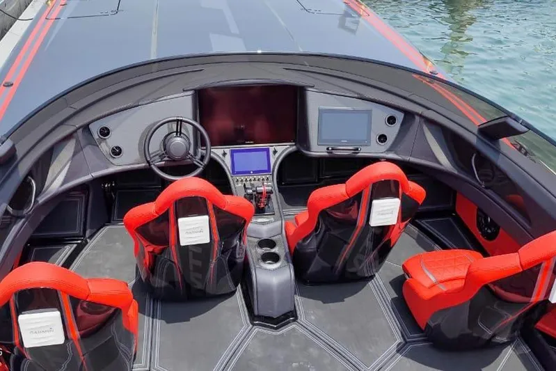  Yacht Photos Pics 2025 MTI 440X boat interior with red seats and advanced navigation systems.