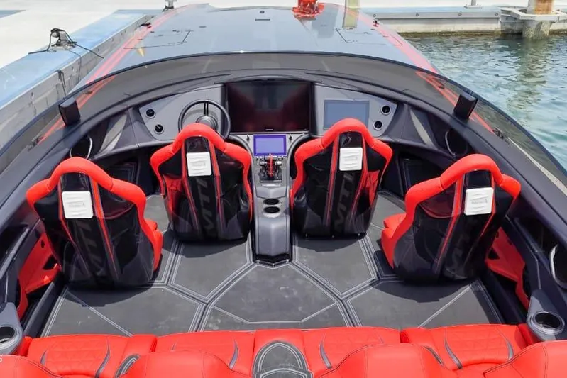  Yacht Photos Pics Interior of 2025 MTI 440X boat with red and black seating, modern dashboard.