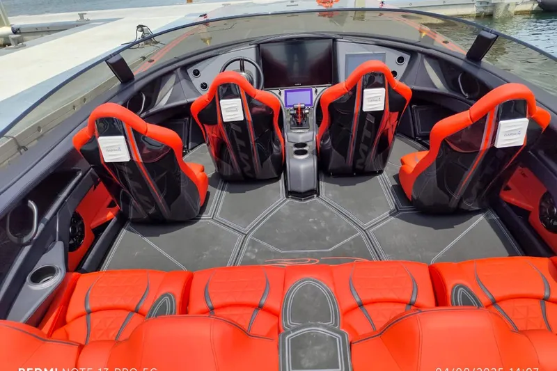  Yacht Photos Pics Interior of 2025 MTI 440X boat with red and black seating, modern dashboard.