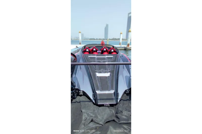  Yacht Photos Pics 2025 MTI 440X luxury speedboat docked at marina with red seating.