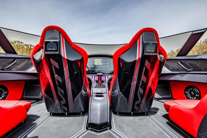  Yacht Photos Pics Interior of 2025 MTI 440X with red seats and advanced dashboard technology.