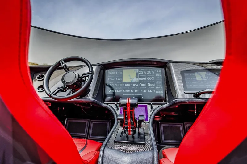  Yacht Photos Pics Interior of 2025 MTI 440X with advanced dashboard and red seats.