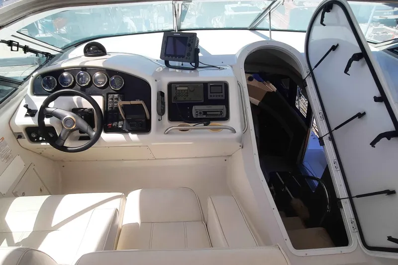  Yacht Photos Pics Interior of 2000 Carver 530 Voyager Pilothouse with steering wheel and navigation equipment.