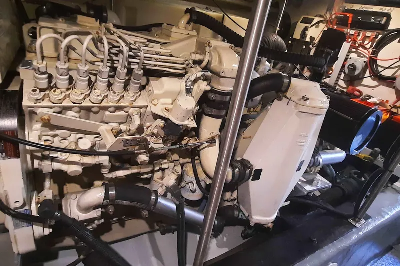  Yacht Photos Pics Engine room of a 2000 Carver 530 Voyager Pilothouse, showcasing complex machinery and components.