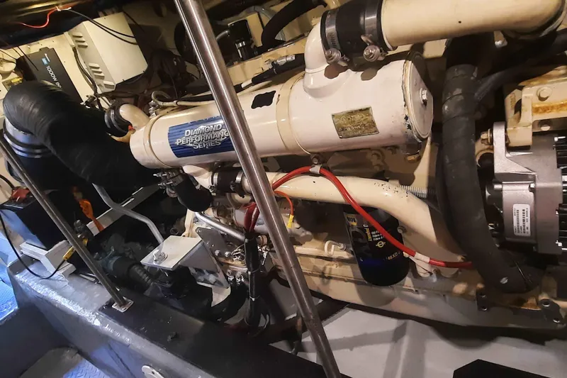  Yacht Photos Pics Engine room of 2000 Carver 530 Voyager Pilothouse, showcasing mechanical components and wiring.