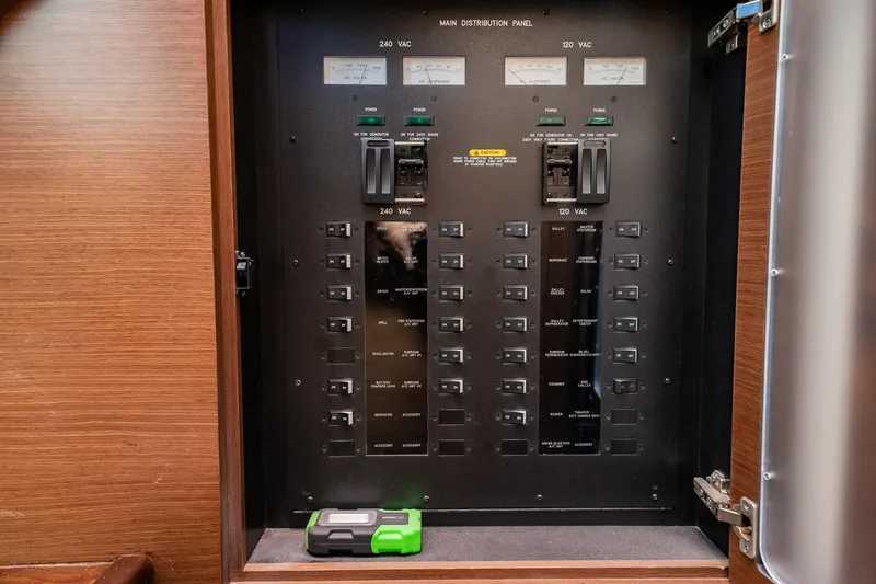 No Shoes Yacht Photos Pics Electrical panel inside 2013 Sea Ray 580 Sundancer yacht, featuring switches and meters.