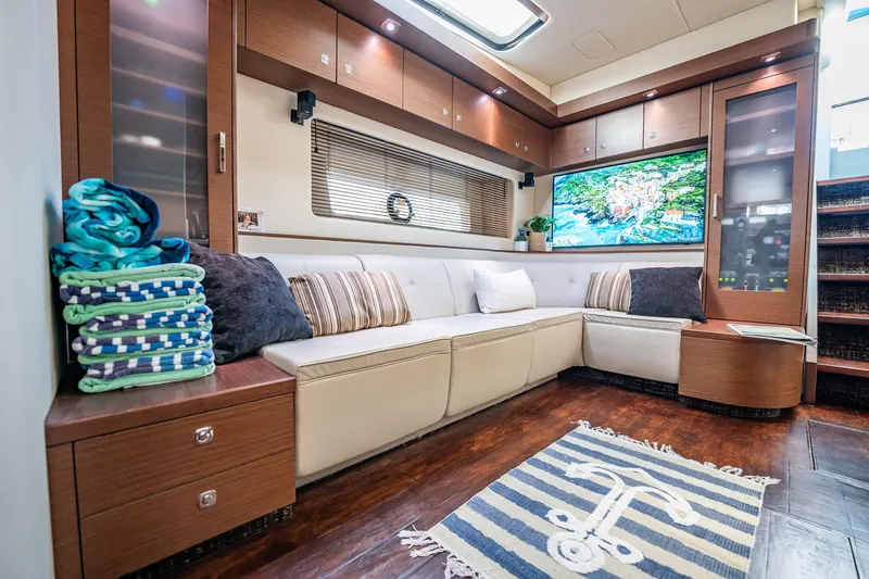 No Shoes Yacht Photos Pics Luxurious interior of 2013 Sea Ray 580 Sundancer yacht with plush seating and modern decor.