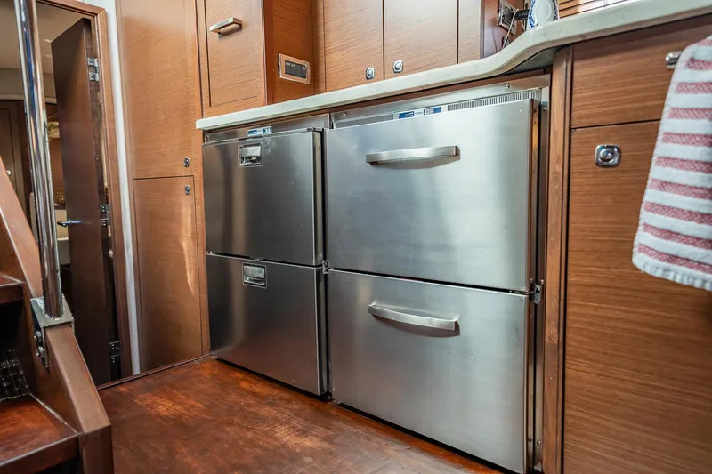 No Shoes Yacht Photos Pics Modern kitchen area in 2013 Sea Ray 580 Sundancer yacht with stainless steel appliances.