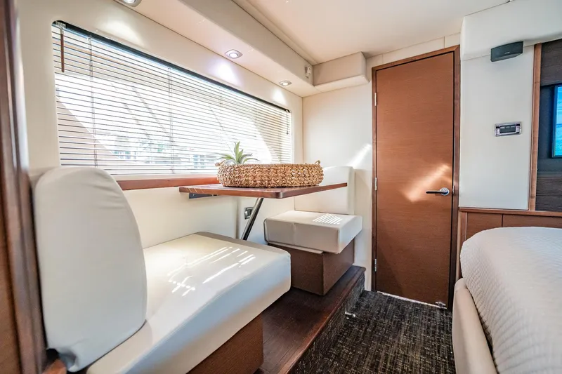 No Shoes Yacht Photos Pics Luxurious interior of 2013 Sea Ray 580 Sundancer yacht with seating and natural light.