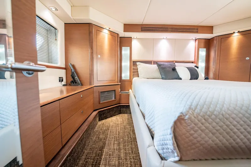 No Shoes Yacht Photos Pics Luxurious cabin interior of 2013 Sea Ray 580 Sundancer yacht with elegant bedding and wood finishes.